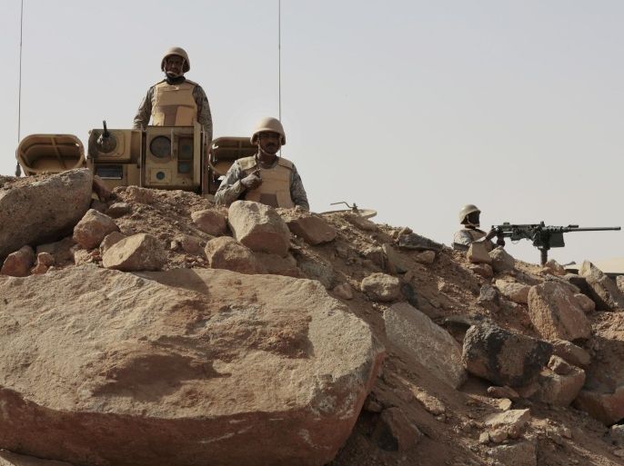 Saudi soldiers stand on top of armor vehicles, on the border with Yemen at a military point in Najran, Saudi Arabia, Tuesday, April 21, 2015. (AP Photo/Hasan Jamali)