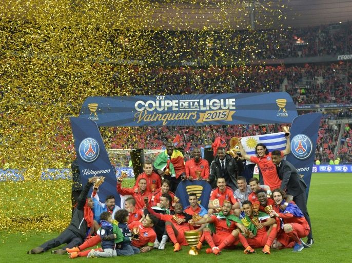Paris' players celebrate their victory at the end of the French League Cup final football match Bastia (SCB) vs Paris Saint-Germain, on April 11, 2015 at the Stade de France in Saint-Denis, outside Paris. AFP PHOTO / LOIC VENANCE