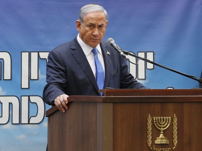 Israel's Prime Minister Benjamin Netanyahu speaks during a Memorial Day ceremony on Mount Herzl military cemetery in Jerusalem, Wednesday, April 22, 2015. Israel on Wednesday marks Memorial Day to commemorate its fallen soldiers. (Ammar Awad/Pool photo via AP)