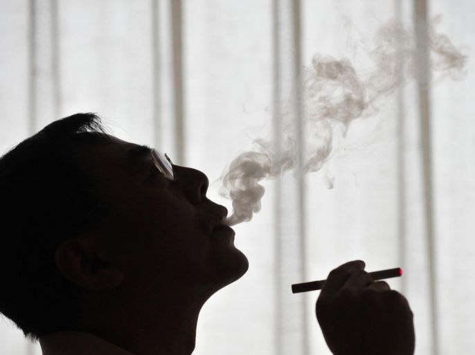 The inventor of the electronic cigarette, Hon Lik smokes his invention in Beiijng on May 25, 2009. Also known as an 'e-cigarette', the battery-powered device is designed as an alternative to cigarettes, cigars and pipes, and provides inhaled doses of nicotine by delivering a vaporized propylene glycol/nicotine solution, while also providing the physical sensation and flavors similar to inhaled tobacco smoke. With 350 million tobacco smokers nationwide, China will join the world in observing World No Tobacco Day on May 31.