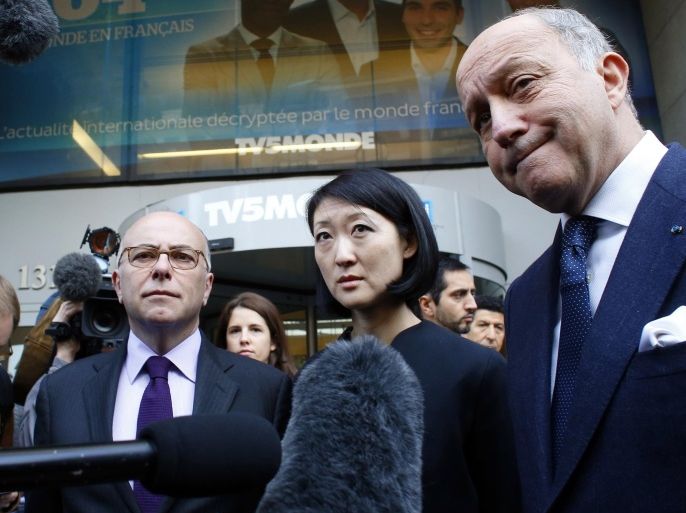 French Interior Minister Bernard Cazeneuve (L), Culture minister Fleur Pellerin (C) and Foreign Affairs Minister Laurent Fabius talk to the press after visiting French television network TV5Monde headquarters in Paris on April 9, 2015, following a cyber-attack by individuals claiming to belong to the Islamic State group. French television network TV5Monde was forced to broadcast only pre-recorded programmes after it was hacked by individuals claiming to belong to the Islamic State group, who also hijacked its websites and social networks. AFP PHOTO / THOMAS SAMSON
