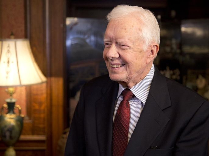 Former U.S. President Jimmy Carter chats with reporters at the Mary Stegmaier Mansion in Wilkes-Barre, Pa., on Tuesday, April 14, 2015. Carter visited Northeastern Pennsylvania to raise money for his "Plains Helping Plains" charity which works to revitalize Carter's hometown of Plains, Ga. (Christopher Dolan/The Citizens' Voice via AP) MANDATORY CREDIT