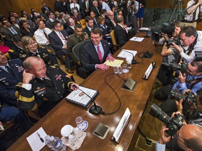 Defense Secretary Ashton Carter (C) and Joint Chiefs of Staff Chairman Martin Dempsey (L) prepare to testify before a Senate Appropriations Committee hearing on the proposed budget estimates and justification for FY2016 for the Defense Department in the Dirksen Senate Office Building in Washington, DC, USA, 06 May 2015. On 05 May President Barack Obama appointed Gen. Joseph F. Dunford Jr. to replace Dempsey as the next Joint Chiefs of Staff.