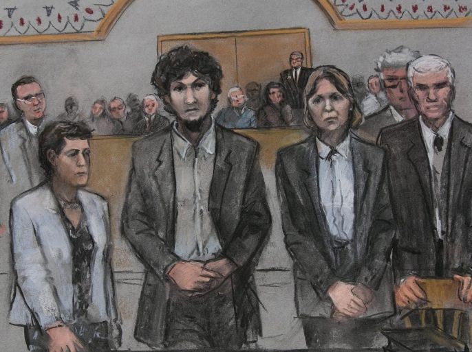 In this courtroom sketch, convicted Boston Marathon bomber Dzokhar Tsarnaev stands with his defense team as he is sentenced to death at the United States courthouse in Boston, Massachusetts, USA, 15 May 2015.