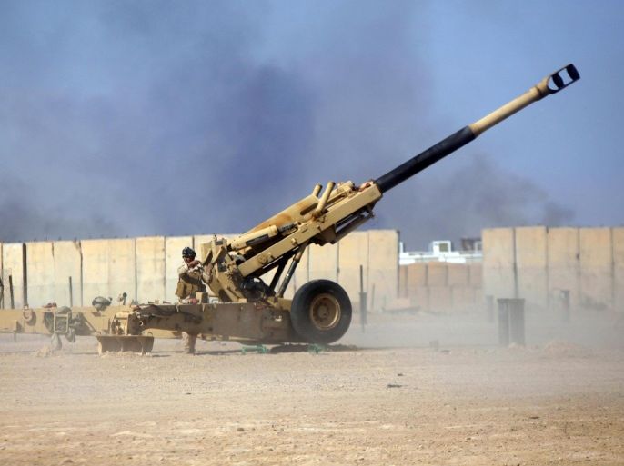 Iraqi security forces fire artillery during clashes with Islamic State militants, outside the city of Falluja March 11, 2015. Picture taken March 11, 2015. REUTERS/Alaa Al-Marjani (IRAQ - Tags: CIVIL UNREST POLITICS CONFLICT)