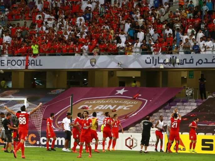 Al-Ahli cheer with their fans during their AFC Champions League football match at Sheik Hazza Bin Zayed stadium in Al-Ain, on May 27, 2015. AFP PHOTO / STR