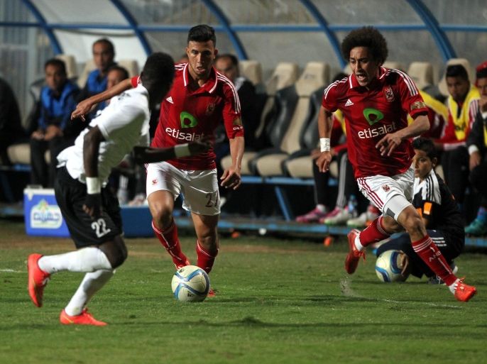 Al Ahly's Hussen Elsayed (R) and Mahmoud Ahmed (C) fights for the ball with Armee Patriotique Rwandaise's Michel Rusheshangoga (L), during the Second leg of their African Champions League (CAF) soccer match between Al Ahly and Armee Patriotique Rwandaise FC, in Cairo, Egypt, 04 April 2015.
