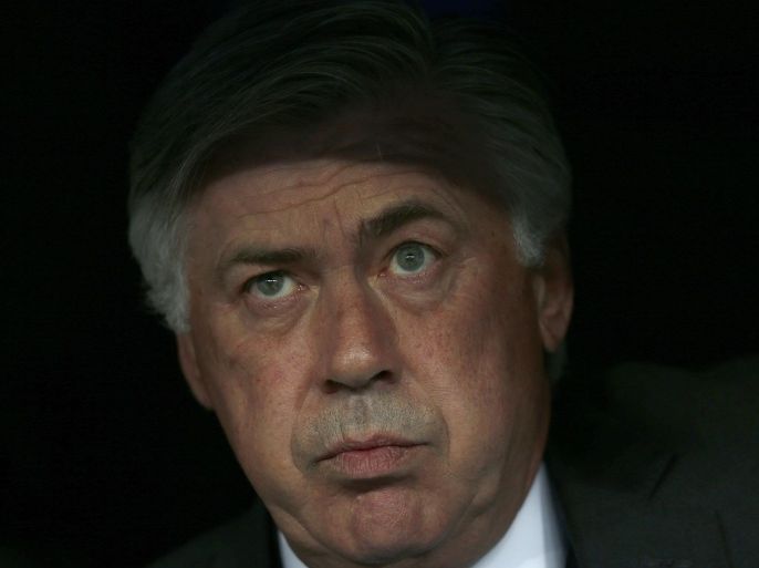 Real Madrid's coach Carlo Ancelotti watches from the dugout during the Champions League second leg semifinal soccer match between Real Madrid and Juventus, at the Santiago Bernabeu stadium in Madrid, Wednesday, May 13, 2015. (AP Photo/Daniel Ochoa de Olza)
