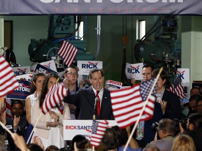 Former U.S. Sen. Rick Santorum, center, stands with his family as he announces his candidacy for the Republican nomination for President of the United States in the 2016 election on Wednesday, May 27, 2015 in Cabot, Pa. (AP Photo/Keith Srakocic)