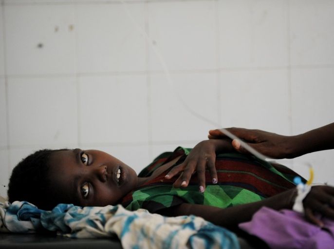 Bisharo Hurow, 10, lays on a cot at a hospital in Mogadishu while suffering from severe diarreah and vomit on August 15, 2011. A cholera epidemic is spreading in famine-hit Somalia, with alarming numbers of cases among people driven to the capital Mogadishu by a lack of food and water, the World Health Organization (WHO) said recently. The intestinal infection often linked to contaminated drinking water, causes severe diarrhea and vomiting, leaving small children especially vulnerable to death from dehydration, according to the United Nations agency. Over 100,000 people have fled into Somalia's famine-hit and war-torn capital in the past two months in search of food, water and medicine. Some 12 million people in parts of Ethiopia, Djibouti, Kenya, Uganda and Somalia are in danger of starvation in the wake of the region's worst drought in decades. War-wracked Somalia is the country hardest hit by the Horn of Africa's drought, with five areas declared to be experiencing famine.