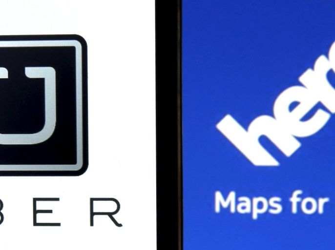 Uber logo is seen on a smartphone in front of a displayed logo of HERE, Nokia Oyj's map business, in Zenica, Bosnia and Herzegovina, in this May 8, 2015 photo illustration. Taxi service Uber has submitted a $3 billion bid for Nokia Oyj's map business HERE, the New York Times reported citing people with knowledge of the offer. Uber and Nokia declined comment. REUTERS/Dado Ruvic