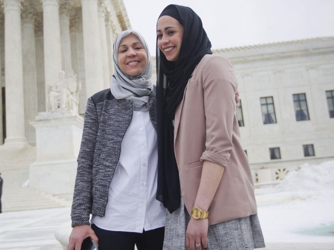 Samantha Elauf, right, with her mother Majda Elauf stand outside the Supreme Court in Washington, Wednesday, Feb. 25, 2015. The Supreme Court is indicating it will side with a Muslim woman who didn't get hired by clothing retailer Abercrombie & Fitch because she wore a black headscarf that conflicted with the company's dress code to her job interview. Liberal and conservative justices aggressively questioned the company's lawyer during arguments at the high court Wednesday in a case that deals with when an employer must take steps to accommodate the religious beliefs of a job applicant or worker. (AP Photo/Pablo Martinez Monsivais)