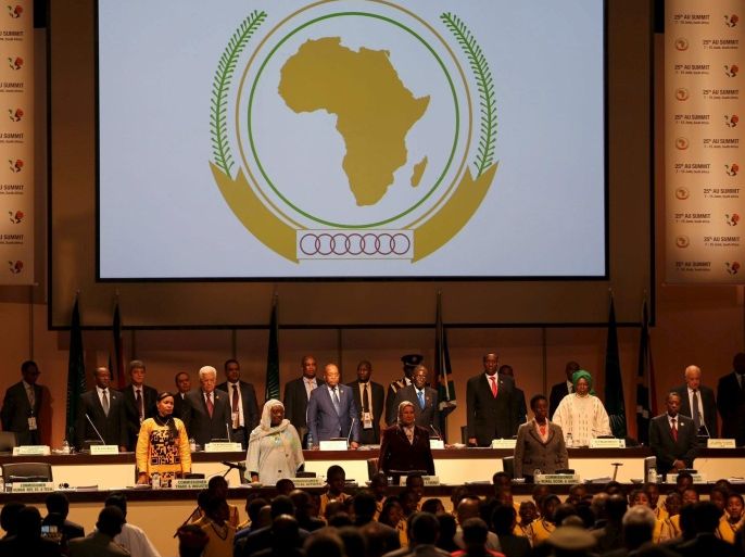 Leaders of the AU stand during the opening of the 25th African Union summit in Johannesburg June 14, 2015. A South African court issued an interim order on Sunday preventing Sudanese President Omar al-Bashir leaving the country, where he was attending an African Union summit, until the judge hears an application calling for his arrest. Bashir is accused in an International Criminal Court arrest warrant of war crimes and crimes against humanity over atrocities in the Darfur conflict. REUTERS/Siphiwe Sibeko