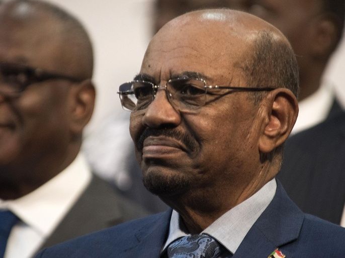 Sudanese President Omar al-Bashir is seen during the opening session of the AU summit in Johannesburg, Sunday, June 14, 2015. A South African judge on Sunday ordered authorities to prevent al-Bashir, from leaving the country because of an international order for his arrest, human rights activists said.(AP Photo/Shiraaz Mohamed)