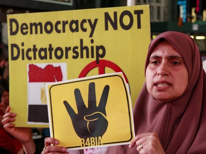 NEW YORK, UNITED STATES - JUNE 17: A group of Egyptian living in New York stage a protest rally at Times Square on June 17, 2015, after the Egyptian court sentenced the former President Mohamed Morsi to death over jailbreak charges.