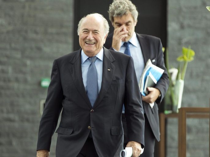 (FILE) A file picture dated 28 September 2012 of FIFA President Joseph Blatter (front) and Walter De Gregorio (back), FIFA's Director of Communications and Public Affairs, arriving for a press conference after a meeting of the FIFA Executive Committee at the FIFA headquarters in Zurich, Switzerland. According to a press release of the FIFA on 11 June 2015, Walter De Gregorio has decided to relinquish his office with immediate effect as Director of Communications & Public Affairs. His Deputy Nicolas Maingot will resume the role ad interim.