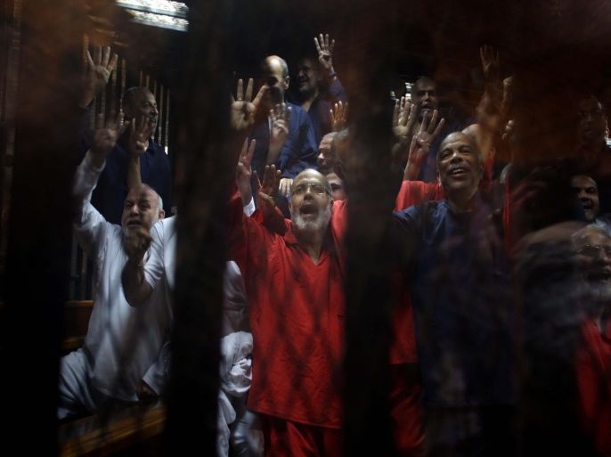 CAIRO, EGYPT - MAY 16 : Co-defendants are seen during the hearing in police academy in Cairo, Egypt on May 16, 2015. An Egyptian court on Saturday referred ousted President Mohamed Morsi and 105 co-defendants to the grand mufti, Egypt's top religious authority, to consider death penalty against them on jailbreak charges.