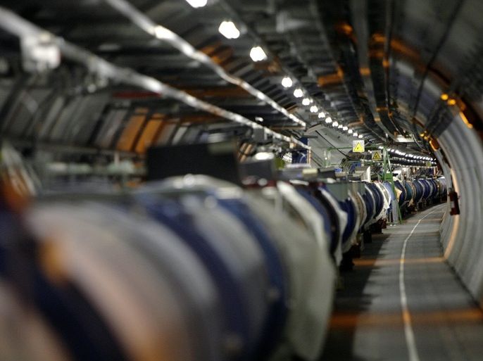 FILE - A May 31, 2007 file photo shows the the LHC (large hadron collider) in its tunnel at CERN near Geneva, Switzerland. The world's biggest particle accelerator is back in action after a two-year shutdown and upgrade, embarking on a new mission that scientists hope could give them a look into the unseen dark universe. Scientists at the European Organization for Nuclear Research, or CERN, on Sunday April 5 2015 shot two particle beams through LHC's 27-kilometer (16.8-mile) tunnel, beneath the Swiss-French border. (AP Photo/Keystone, Martial Trezzini, File)
