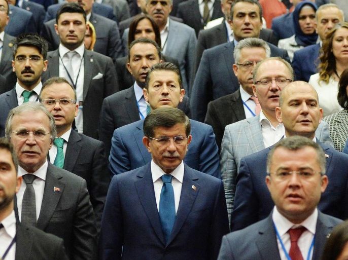 Turkish Prime Minister Ahmet Davutoglu (C) attends a meeting of provincial chairmen of his Justice and Development Party (AKP) at the party's headquarters in Ankara, Turkey on June 11, 2015. Turkey's ruling party will hold talks with the opposition on forming a coalition government, after it lost its overall parliament majority in legislative elections. AFP PHOTO/ ADEM ALTAN
