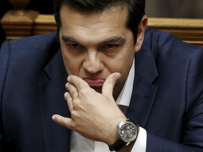 Greek Prime Minister Alexis Tsipras is pictured before his speech at a parliamentary session to brief lawmakers over the ongoing talks with the country's lenders, in Athens, Greece June 5, 2015. Tsipras on Friday branded a cash for reforms proposal by his country's creditors an "absurd" one that he cannot accept and said he hoped it would be taken back. In an uncompromising speech to parliament, Tsipras said a proposal by Athens made earlier this week was the only realistic basis for a deal with creditors. REUTERS/Alkis Konstantinidis TPX IMAGES OF THE DAY