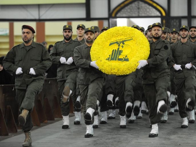 Hezbollah militants carry a flower wreath in the colors of the Shiite Muslim group's logo during a rally marking Hezbollah Martyrs' Day at the southern suburbs Beirut, Lebanon, 11 November 2011. According to local media, Hezbollah leader Hassan Nasrallah delivered a speech touching the issue of financing the Special Tribunal for Lebanon, the situation in Syria and the latest developments in the Middle East, especially the Iranian nuclear program and tension with the Western countries. EPA/WAEL HAMZEH