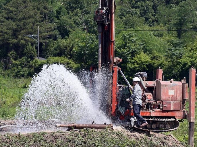 Groundwater gushes out of a tube well in the city of Pocheon, northeast of Seoul, South Korea, 17 June 2015, after workers dug it to irrigate rice paddies and other farmland hit by drought. This year's rainy season is forecast to start later than the average year, with a prolonged shortage of rainfall feared to deal a blow to the country's crop farming. EPA/YONHAP SOUTH KOREA OUT