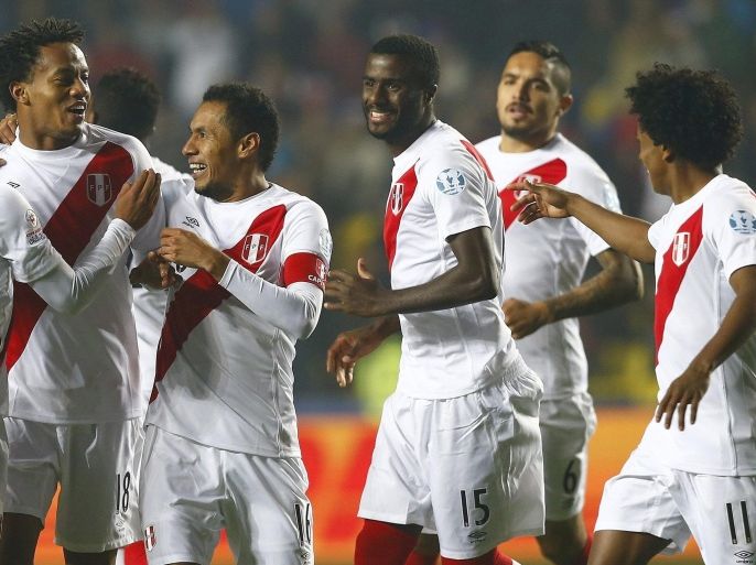 Peruvian striker Andre Carrillo (2-L) celebrates with teammates after scoring during the Copa America 2015 third and fourth place final soccer match between Peru and Paraguay, at Estadio Municipal Alcaldesa Ester Roa Rebolledo in Concepcion, Chile, 03 July 2015.