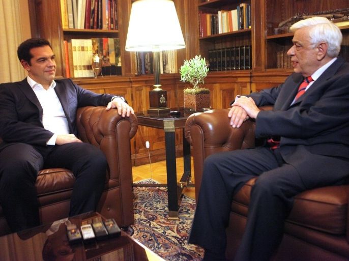 ATHENS, GREECE - JULY 6: Greek Prime Minister Alexis Tsipras meets Greek President Prokopis Pavlopoulos (R) at Presidency in Athens, Greece on July 6, 2015. Greece has voted in a referendum to decisively reject further austerity measures proposed by its creditors. With 90 percent of the votes counted in Sunday's referendum, more than 61 percent of the voters backed the government stance, as the turnout hovered around 60 percent.