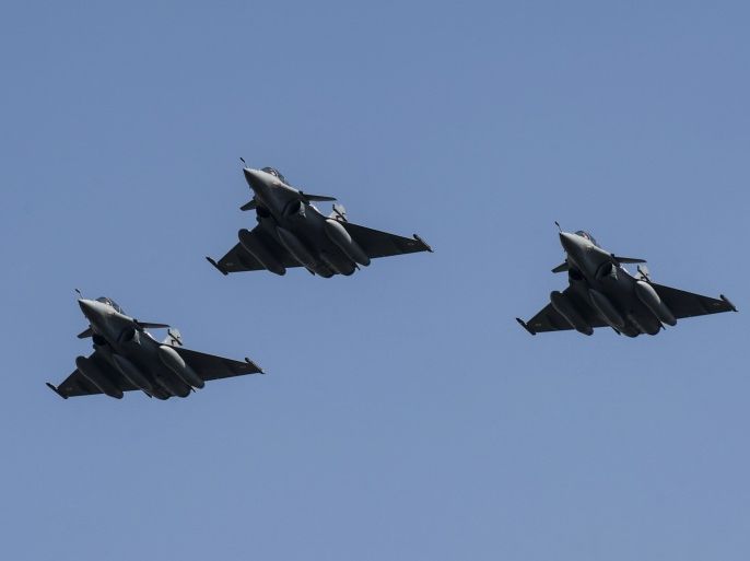 Three French made Rafale fighter jets fly with other Egyptian air force warplanes (unseen) above Cairo, on July 21, 2015
