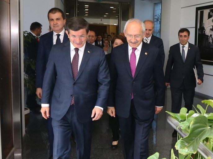 ANKARA, TURKEY - JULY 13 : Turkish Prime Minister and Justice and Development Party leader, Ahmet Davutoglu (L) meets with Republican Peoples Party (CHP) leader, Kemal Kilicdaroglu (R) as he arrives at party headquarters to hold first coalition discussions with CHP chairman on July 13, 2015 in Ankara, Turkey.