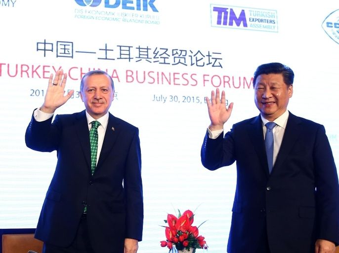 BEIJING, CHINA - JULY 30: Turkish President Recep Tayyip Erdogan (L) and Chinese President Xi Jinping (R) attend the Turkey-China Business Forum on July 30, 2015 in Beijing, China.