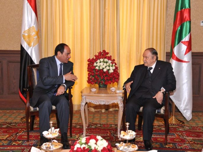 ALGIERS, ALGERIA - JUNE 25: Egyptian President Abdel-Fattah al-Sisi (L) meets with Algerian President Abdelaziz Bouteflika (R) athis office in Algiers, Algeria on June 25, 2014. Egyptian President arrives in Algiers for his first trip abroad since being elected in May.