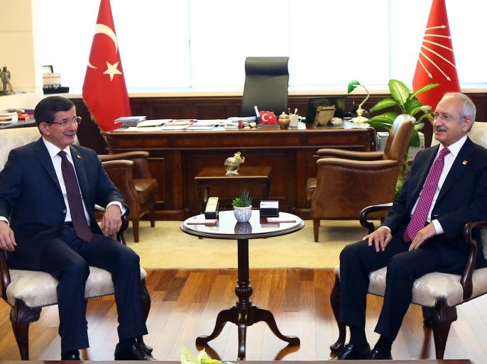 Turkish Prime Minister and leader of Justice and Development Party Ahmet Davutoglu, left, and the leader of the main opposition Republican People's Party, CHP, Kemal Kilicdaroglu during a meeting in Ankara, Turkey, Monday, July 13. 2015. Davutoglu has begun a first round of talks on forming a coalition government by meeting officials of Turkey’s secularist party, CHP, his ruling Islamic-rooted party’s arch-foe. Davutoglu met with Kilicdaroglu on Monday, a month after Turkey’s June 7 election left his party short of a majority, forcing it to seek a coalition alliance.(AP Photo)