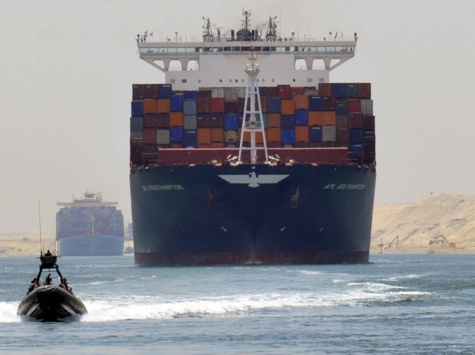 A cargo ship is seen crossing through the New Suez Canal, Ismailia, Egypt, July 25, 2015. The first cargo ships passed through Egypt's New Suez Canal on Saturday in a test-run before it opens next month, state media reported, 11 months after the army began constructing the $8 billion canal alongside the existing 145-year-old SuezCanal. Mohab Mameesh, chairman of the Suez Canal Authority overseer of the project, told state television that this test-run had been a success and that more would follow.REUTERS/Stringer TPX IMAGES OF THE DAY