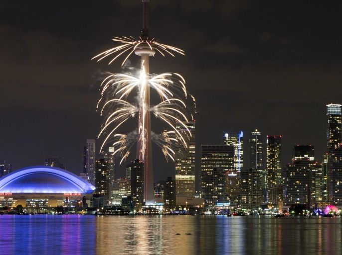 Fireworks explode off the CN Tower in downtown Toronto, during the opening ceremonies for the Pan Am Games, Friday, July 10, 2015. (AP Photo/Rebecca Blackwell)