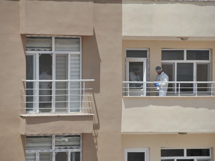 SANLIURFA, TURKEY - JULY 22: Police crime scene investigators inspect an apartment where two police officers were found dead in Ceylanpinar town of Sanliurfa, southern Turkey on June 22, 2015. The men were found dead at the home they shared in Ceylanpinar, a town on the Syrian border that lies 120 kilometers (75 miles) east of Suruc, where Mondays bomb blast killed 32.