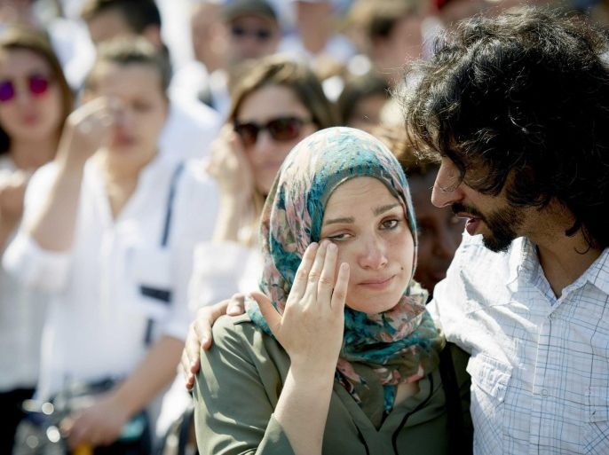People attend the remembrance of the victims of the Srebrenica massacre on the Plein, in The Hague, The Netherlands, 11 July 2015. On the same day at the Potocari Memorial Center in Srebrenica, Bosnia and Herzegovina, 136 newly-identified Bosnian Muslims were buried as part of a memorial ceremony to mark the anniversary of the Srebrenica massacre. July 2015 marks the 20-year anniversary of the Srebrenica Massacre that saw more than 8,000 Bosnians men and boys killed by Bosnian Serb forces during the Bosnian war. On 08 July Russia vetoed a United Nations Security Council resolution that would have labeled as genocide the 1995 massacre of Muslims in Srebrenica by ethnic Serbs.