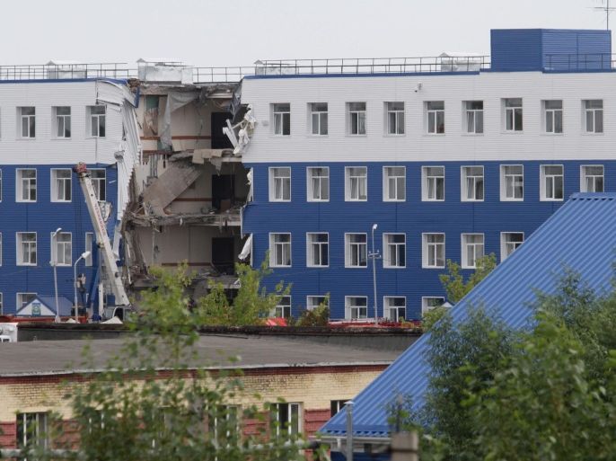 General vew of the site of an army quarters collapse in the Airborne Forces training center near Omsk, Russia, 13 July 2015. The death toll of collapse of a section of a four-storey building has amounted to 23 servicemen, media report.