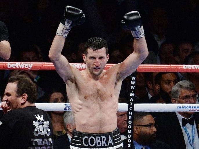 British boxer Carl Froch celebrates following his knock out win over compatriot George Groves during their IBF WBA Super Middleweight world title fight at Wembley Stadium in London, Britain, 31 May 2014.
