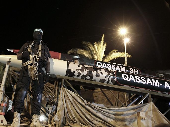 Fighters of Ezz Al-Din Al Qassam militia, the military wing of Hamas stand near new Qassam rockets, Qassam (A) and Qassam (SH), during a rally marking the first anniversary of the 50-day Israeli war against Gaza Strip, in the central of Gaza City on, 08 July 2015. (Qassam A) and (Qassam SH) the first characters in the names of two leaders of Ezz Al-Din Al Qassam militia, the military wing of Hamas, Mohammed Abu Shamalla and Raed Al Attar, who were killed in Rafah town during Israeli war against Gaza strip in 2014. According to UN reports, there were 2,251 Palestinians killed between June and August of 2014, about half of them civilians. It also counted six civilians in Israel and 67 Israeli soldiers among the victims of the conflict.