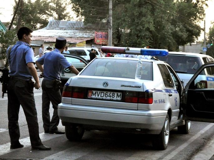 BISHKEK, KYRGYZSTAN - JULY 16: Kyrgyz security forces at the site of the shoot-out as four suspected members of an international terror organization are killed on July 16, 2015 in the Kyrgyz capital Bishkek during an anti-terror operation, which also saw four security forces injured.