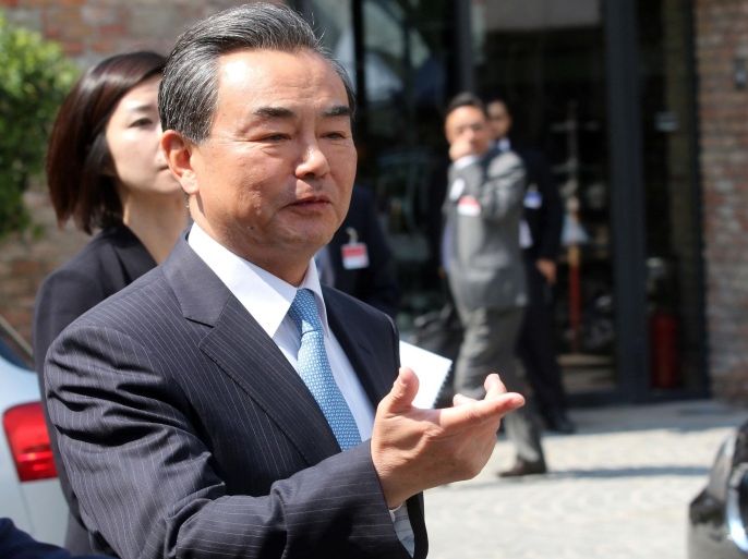 Chinese Foreign Minister Wang Yi arrives to inform the media in front of Palais Coburg where closed-door nuclear talks with Iran take place in Vienna, Austria, Thursday, July 2, 2015. (AP Photo/Ronald Zak)