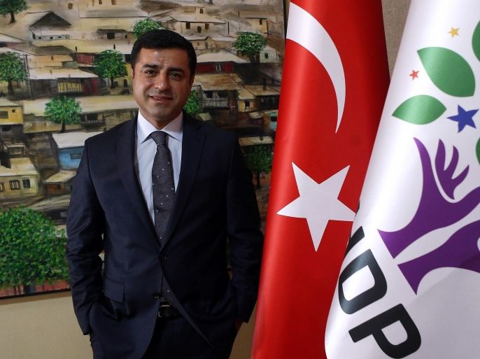 TO GO WITH AFP STORY BY FULYA OZERKAN Selahattin Demirtas, co-leader of the pro-Kurdish People's Democratic Party (HDP), poses during an interview in Ankara on July 30, 2015. The co-leader of Turkey's main Kurdish party on Thursday dismissed air strikes and police raids by Ankara against Islamic State (IS) jihadists as a 'show', saying their real target was Kurdish militants. AFP PHOTO / ADEM ALTAN