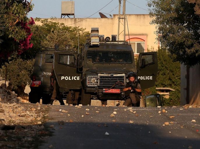 NABLUS, WEST BANK - JULY 25: Israeli police intervene a group of Palestinian protesting the separation barrier and construction of Israeli settlement, on July 25, 2015, in Nalbus' Kafr Kaddum village, Nablus, West Bank.