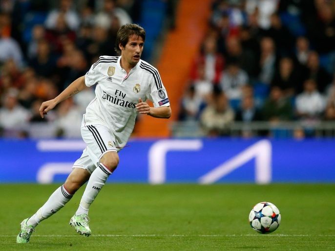 MADRID, SPAIN - MARCH 10: Fabio Coentrao of Real Madrid runs with the ball during the UEFA Champions League Round of 16 second leg match between Real Madrid CF and FC Schalke 04 at Estadio Santiago Bernabeu on March 10, 2015 in Madrid, Spain.