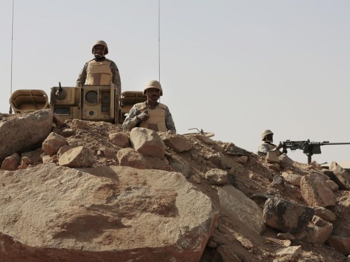 FILE - In this Tuesday, April 21, 2015 file photo, Saudi soldiers stand on top of armor vehicles, on the border with Yemen at a military point in Najran, Saudi Arabia. A Saudi-owned news channel, al-Hadath, aired live footage Monday, May 11, 2015 of tanks and armored personnel carriers loaded onto giant trucks, saying they were part of a "strike force" deploying to the kingdom's border with Yemen. There have been no signs to suggest that a ground offensive was imminent, although the coalition has not ruled one out.(AP Photo/Hasan Jamali, File)