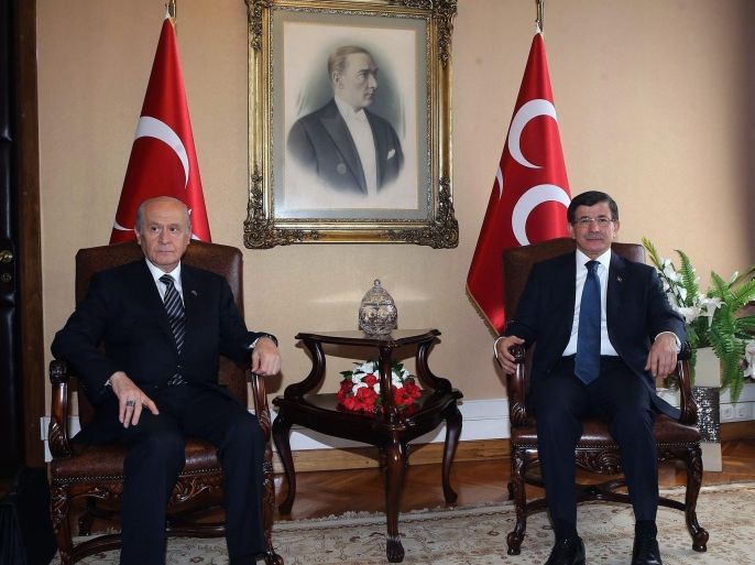 Turkish Prime Minister Ahmet Davutoglu (R) and Nationalist Movement Party (MHP) leader Devlet Bahceli (L) sit for a meeting on a coalition in Ankara, Turkey, 17 August 2015. Davotoglu and Bahceli met for a last effort to form a coaltion before deadlines. Another round of elections looked likely in Turkey after previous coalition talks between the country's ruling AKP party and the opposition CHP failed, more than two months after parliamentary elections.