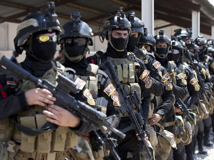 BAGHDAD, IRAQ - JULY 23: Members of the Iraqi Counter Terrorism Service force participate in a training exercise as U.S. Defense Secretary Ash Carter observes at the Iraqi Counter Terrorism Service Academy on the Baghdad Airport Complex July 23, 2015 in Baghdad, Iraq. Carter is on a week long tour of the Middle East focused on reassuring allies about Iran and assessing progress in the coalition air campaign against the Islamic State in Syria and Iraq.