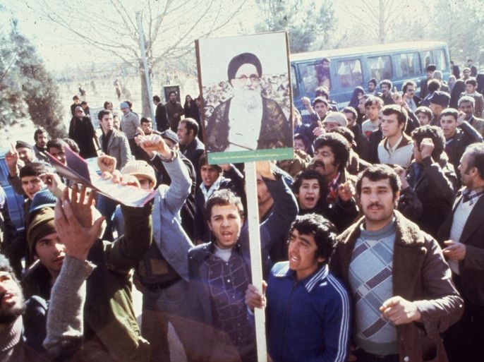 1979: Demonstrators in Teheran calling for the replacement of the Shah of Iran during the Iranian Revolution. They carry placards depicting Ayatollah Mahmoud Talaghani, one of Iran's most militant religious leaders.
