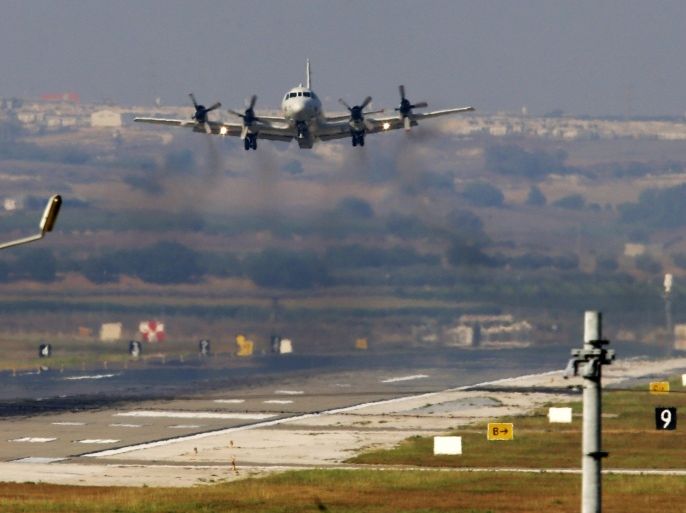 A United States Navy aeroplane about to land at the Incirlik Air Base, in the outskirts of the city of Adana, southern Turkey, Wednesday, July 29, 2015. Turkish Foreign Ministry spokesman Tanju Bilgic said Wednesday, that an agreement allowing the U.S.-led coalition against the IS to launch airstrikes from Incirlik and other Turkish bases has been approved by Cabinet. Coalition forces could start using the bases “any moment,” Bilgic said. (AP Photo/Emrah Gurel)